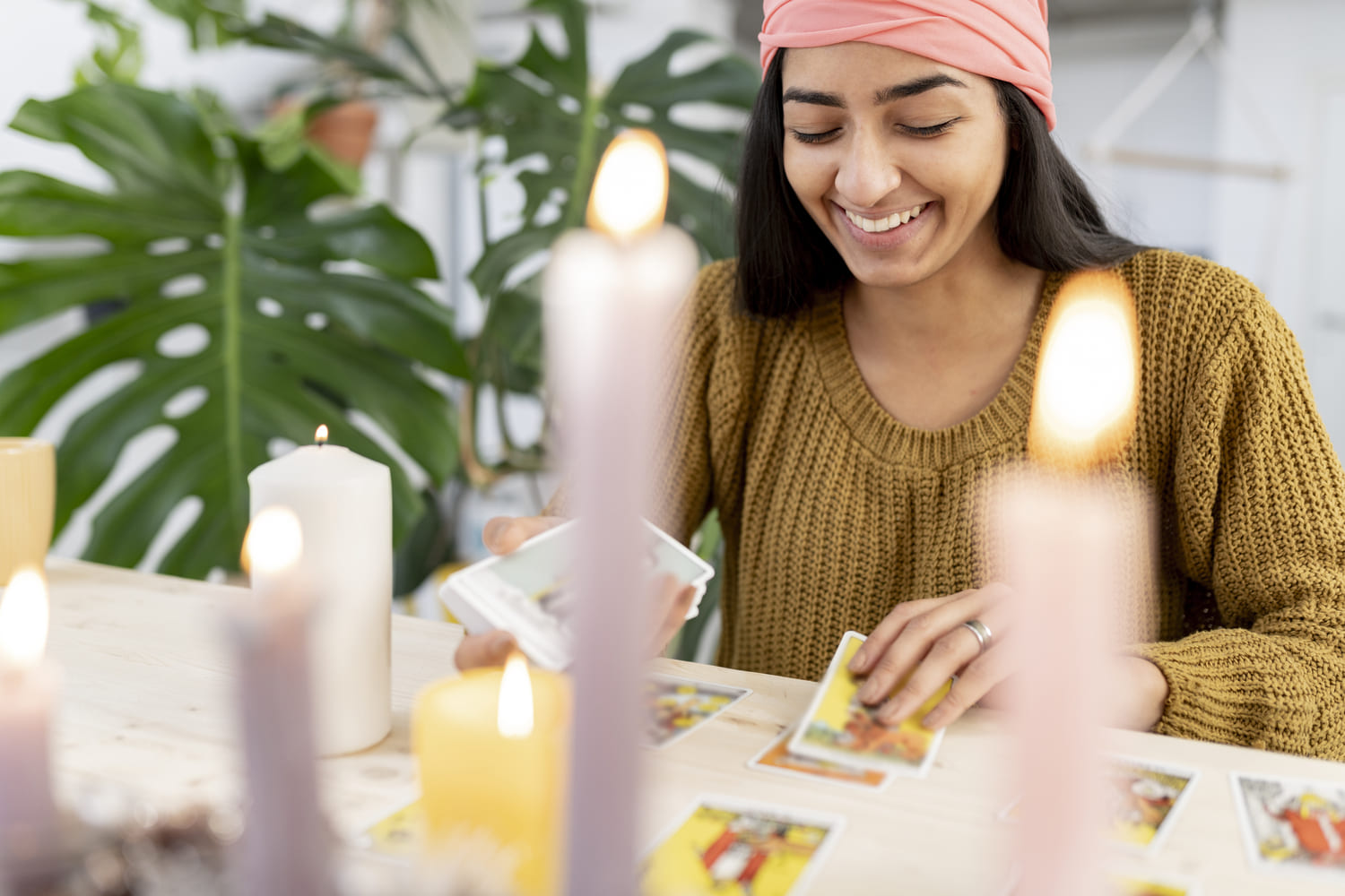 Angel Reading - happy woman cards behind candles